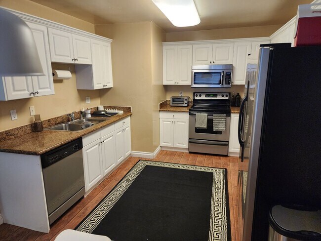 Photo - Upstairs end unit with AC and a private entrance 2 bedroom condo in a quiet area of Spring Valley... Unit 5