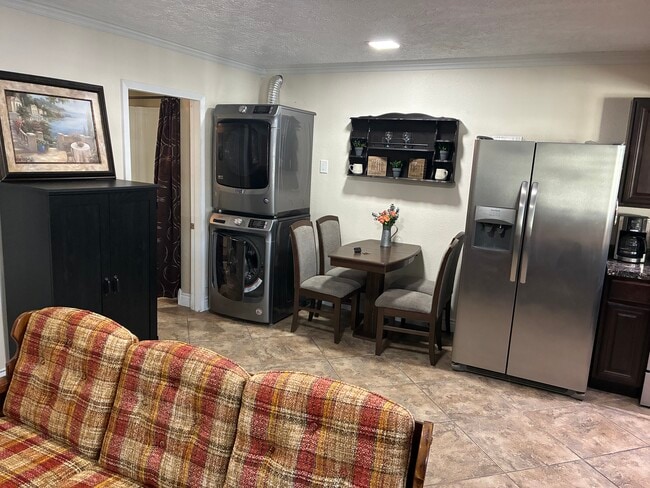 Laundry units and bathroom entrance. - 29984 Big Range Rd