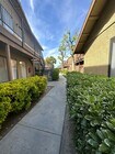 Walkway between buildings at Riverdale Apartment Homes in Hemet, California. - Riverdale Apartments