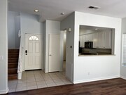 Kitchen to staircase view - 10924 Creekbridge Plz Townhome