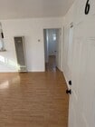 Newer flooring throughout leading to private bedroom with bath - 4626 E 7th St Unit upstairs 1bed 1bath