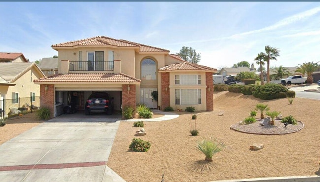 Building Photo - Spacious 4-Bedroom Home with Beautiful Desert Landscaping!