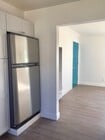 this is part of the kitchen and looking towards the front door - 110 S Grand Oaks Ave Apartments Unit 2