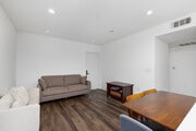 4BD, 3BA - 1,309SF - Living Room - 1539 Beloit Ave Apartments