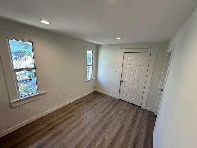 Building Photo - Located on a large lot, along with only four other cottage units, sits this 2 bedroom 1 bath unit