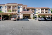 Parking lot into entrance - Flamingo Garden Senior Apts