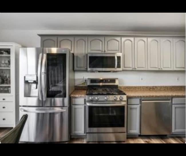 Kitchen with stainless steel appliances and ample cabinet space. - 940 Calla Ave Unit 8