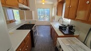 Kitchen from backyard entrance - 2471 Riverside Pl House