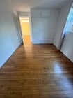 all wood floors in living room, dining area, and bedrooms - 663 Marine St Unit B