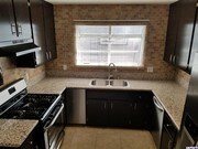 Kitchen w/granite - 9414 Moonbeam Ave