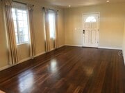 Great room style living room. Hard wood floors. - 2208 Gramercy Ave