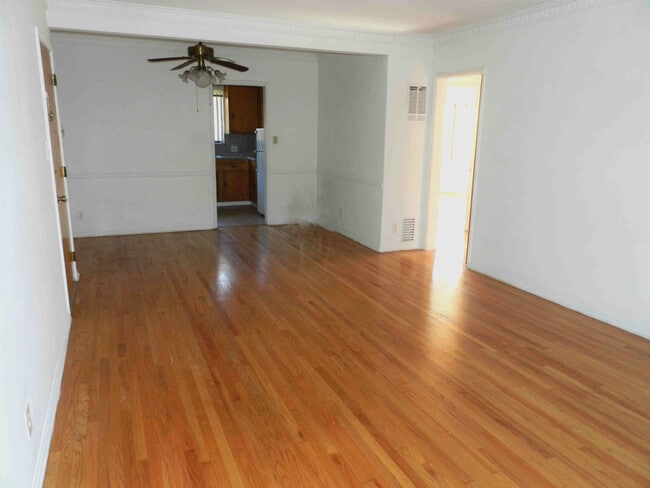 Dining Area, View in to Kitchen and hallway pockets doors can closet both Areas - 108 N Hayworth Ave Unit 4