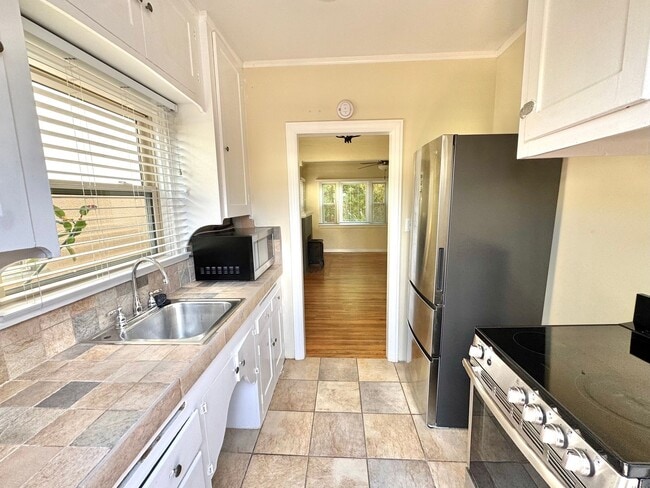 Photo - Cute North Park Bungalow! 2bd/1ba, 1 car garage, AC, W/D in-unit, fenced yard!