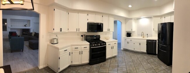 Kitchen fully equipped with appliances, cookware, and silverware for making meals at home a breeze. - 15860 Alisa Viejo Ct Unit House