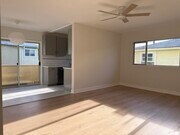 Living room, peek of kitchen and patio - 1533 Princeton St Unit #6