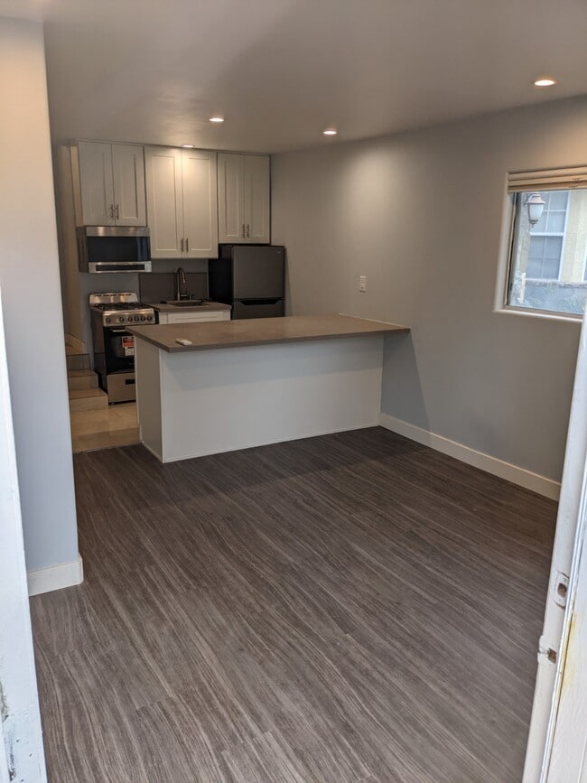 Living room and Kitchen w/peninsula - 17915 Erwin St Unit Apartment