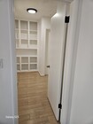 Hallway to bedrooms and linen closet - 1344 E Windsor Rd Unit A/front