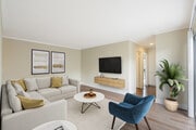 Renovated Package I living room with hard surface flooring - eaves Lake Forest Apartments