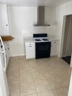 Kitchen refrigerator included with unit - 11280 Morrison St Apartments