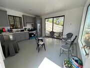 Open floor plan - living and kitchen space. - 4435 Radium Dr