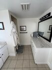 Quarts counter tops in large walk in bathroom with vanity and storage! Rare find for a studio! - 125 26th St