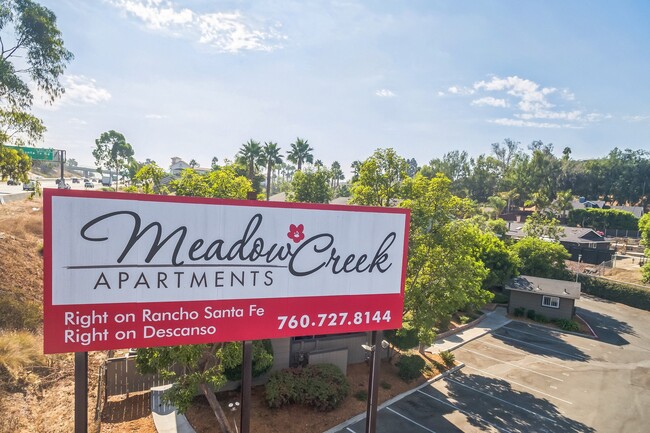 An aerial view of our Billboard Sign leading you home to Meadow Creek Apartments in San Marcos, CA - Meadow Creek Apartments