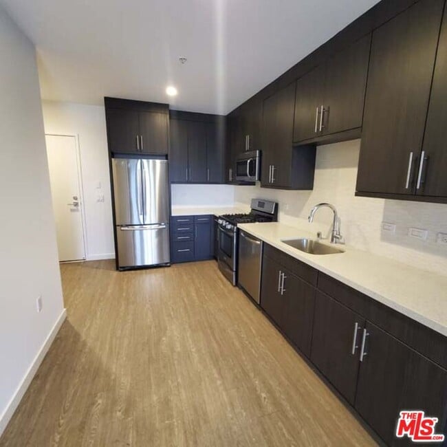 Building Photo - 11405 Chandler Blvd Unit 507-507 Rental