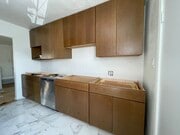 Custom-made cherry wood kitchen cabinets - 2625 7th Ave Apartments Unit 2625