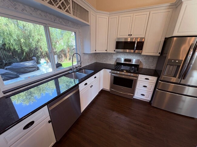 Photo - Upgraded 3 bedroom, 2 1/2 bath home with HUGE private yard. This is a true hidden gem.