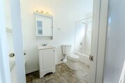 Bathroom with new toilet and tub - 4030 38th St #7