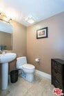 Half bathroom after entryway - 1951 N Beachwood Dr Condo Unit 203