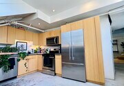 Kitchen with stainless built-in appliances (fridge, stove/oven, microwave, dishwasher) - 200 N San Fernando Rd Condo Unit 110