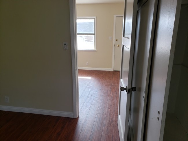 Bedroom to front room--New flooring - 3519 Orchard Ave Apartments Unit D upstairs