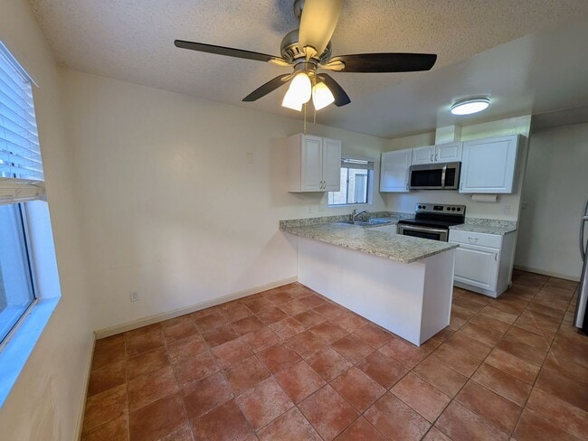 Photo - Bright and Charming 3 Bedroom 2 Bath Condo with Patio and A/C! Unit 4