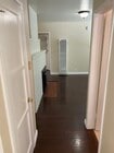 Hallway to living room and bathroom - 11280 Morrison St Apartments