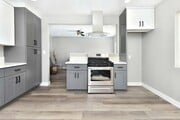 Kitchen opening to living - 4621 W 170th St House