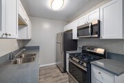 2BR, 1BA - 1,150SF - Kitchen - Camelot Apartments