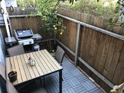 Back patio with updated flooring - 1809 Armour Ln Condo Unit 1
