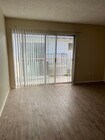 Family room with balcony - 16932 Lilac Lane Apartments Unit 3