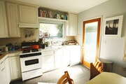 Kitchen with gas stove and new stainless fridge/freezer. - 12133 Marshall St