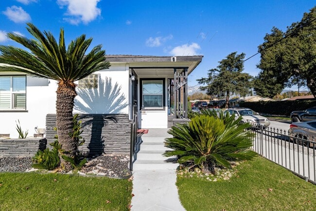 Building Photo - 587 E Arrow Hwy Unit 587 E. Arrow Hwy