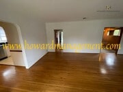 Photo - Beautiful home with large Den, hardwood floors, grassy backyard and dettached 2 car garage.