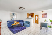 After a day exploring Balboa Park, unwind on the soft blue-themed sofa - 2304 E 14th St House