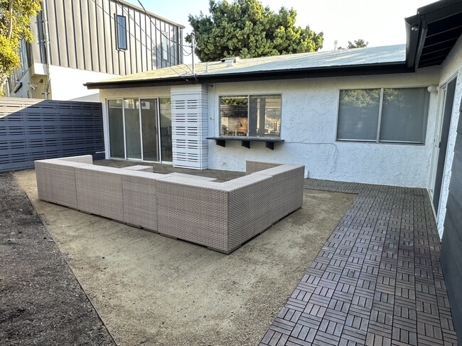 The generous backyard offers ample room for lounging - 5214 Dawes Ave