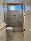 Bathroom with glass shower door - 13401 Victory Blvd Unit #8