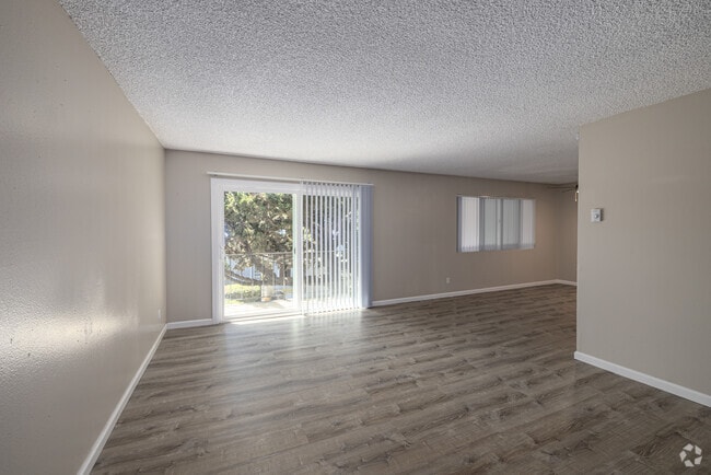 2BR, 1BA - 1,150SF - Living Room - Camelot Apartments