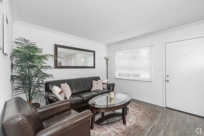 1BR, 1BA - 700SF - Living Room - Village Apartments