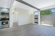 Living Room, Patio, Entrance to Bedroom - 11301 Gladwin St Apartment Unit 11301