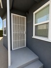gated entry with private front yard - 4091 Rosecrans Ave
