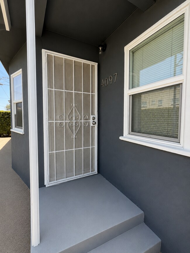 gated entry with private front yard - 4091 Rosecrans Ave